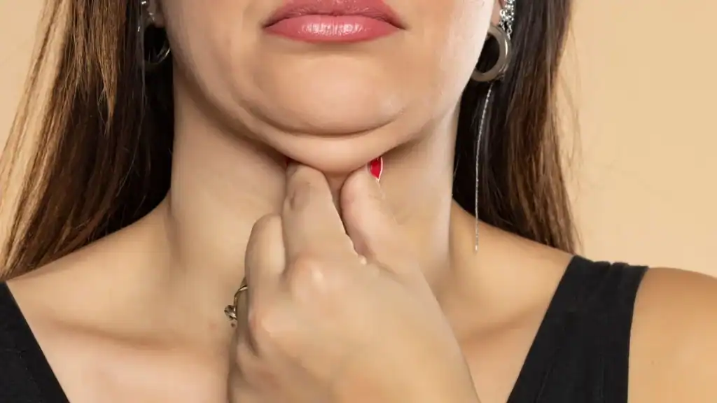 An image of a woman with double chin, sad, worried : Non Surgical Double Chin Removal Treatment in Soho, UK